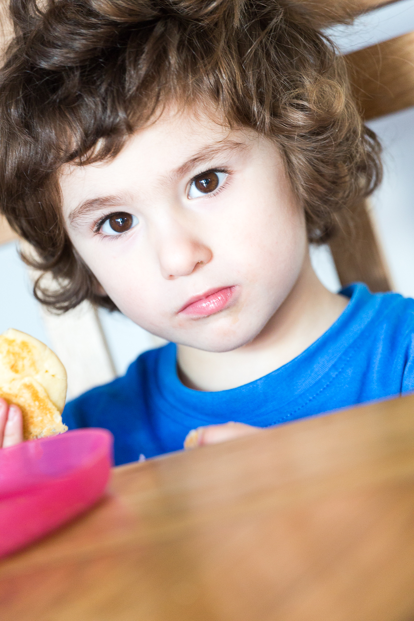 cute child eating gluten-free American pancakes