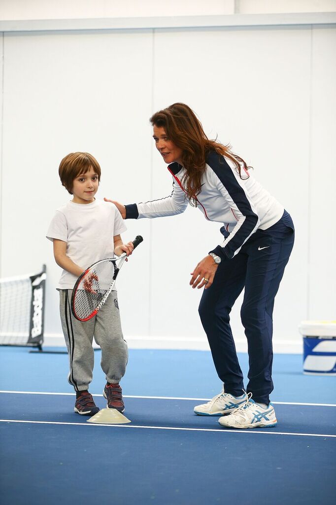 Annabel Croft teaches Oliver Broadbent tennis