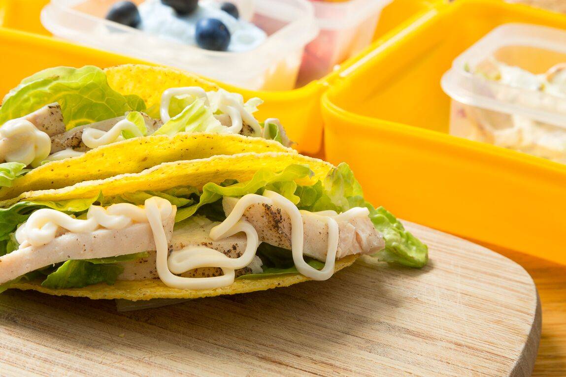 Sliced chicken, a little mayo and lettuce corn tortillas.