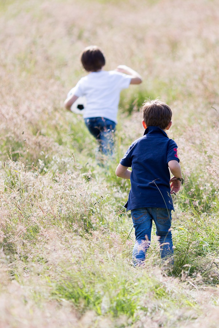 boys running through fields