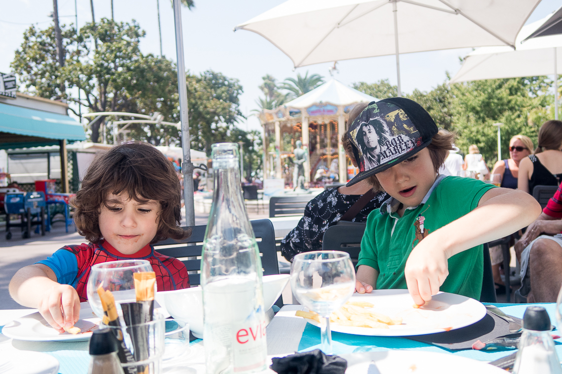 children eating food in a restaurant in Cannes