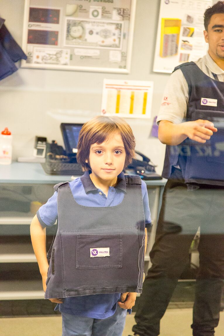 learning to be a security guard at a bank at Kidzania