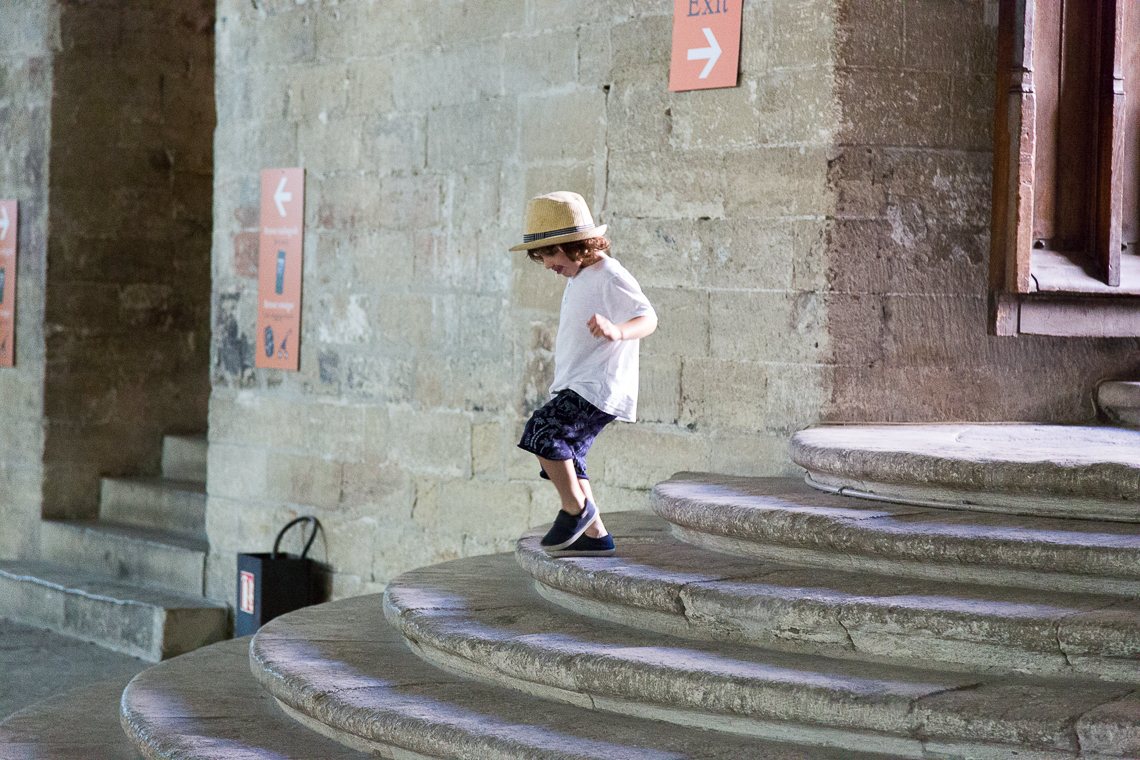 Little boys walks down the steps in the Palais Des Papes- Avignon
