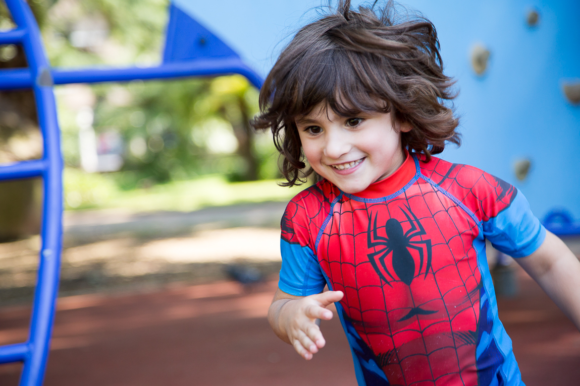 kid running in Spiderman swimsuit