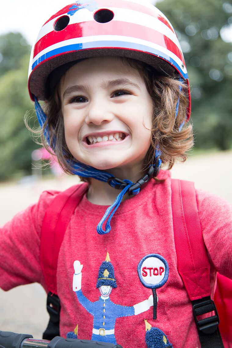 Little child wearing a helmet and smiling