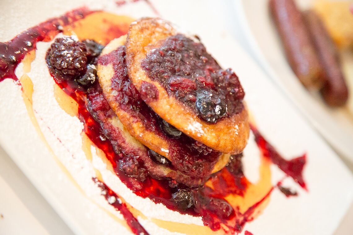 Pancakes and berry coulis served at the Royal Garden Hotel in London
