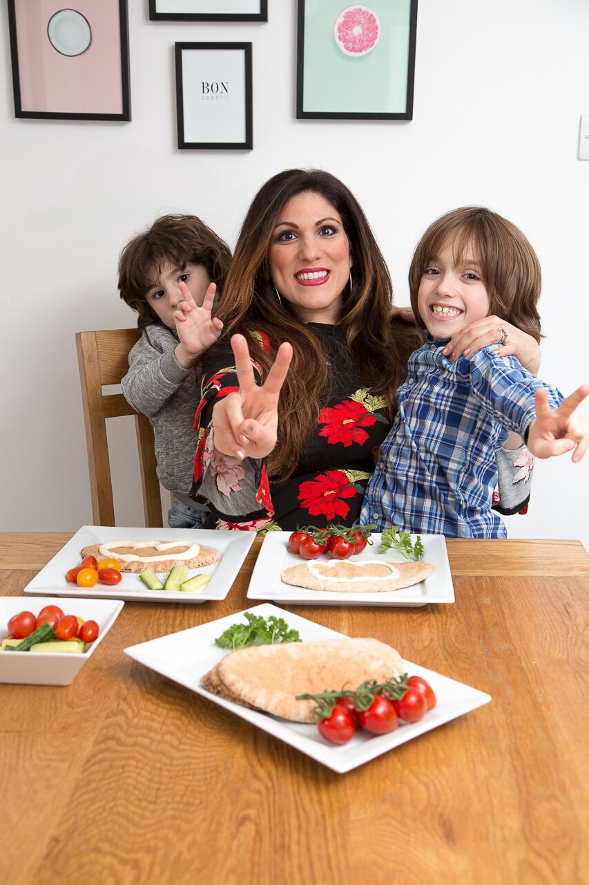 Family enjoy primula cheese on pitta with salad