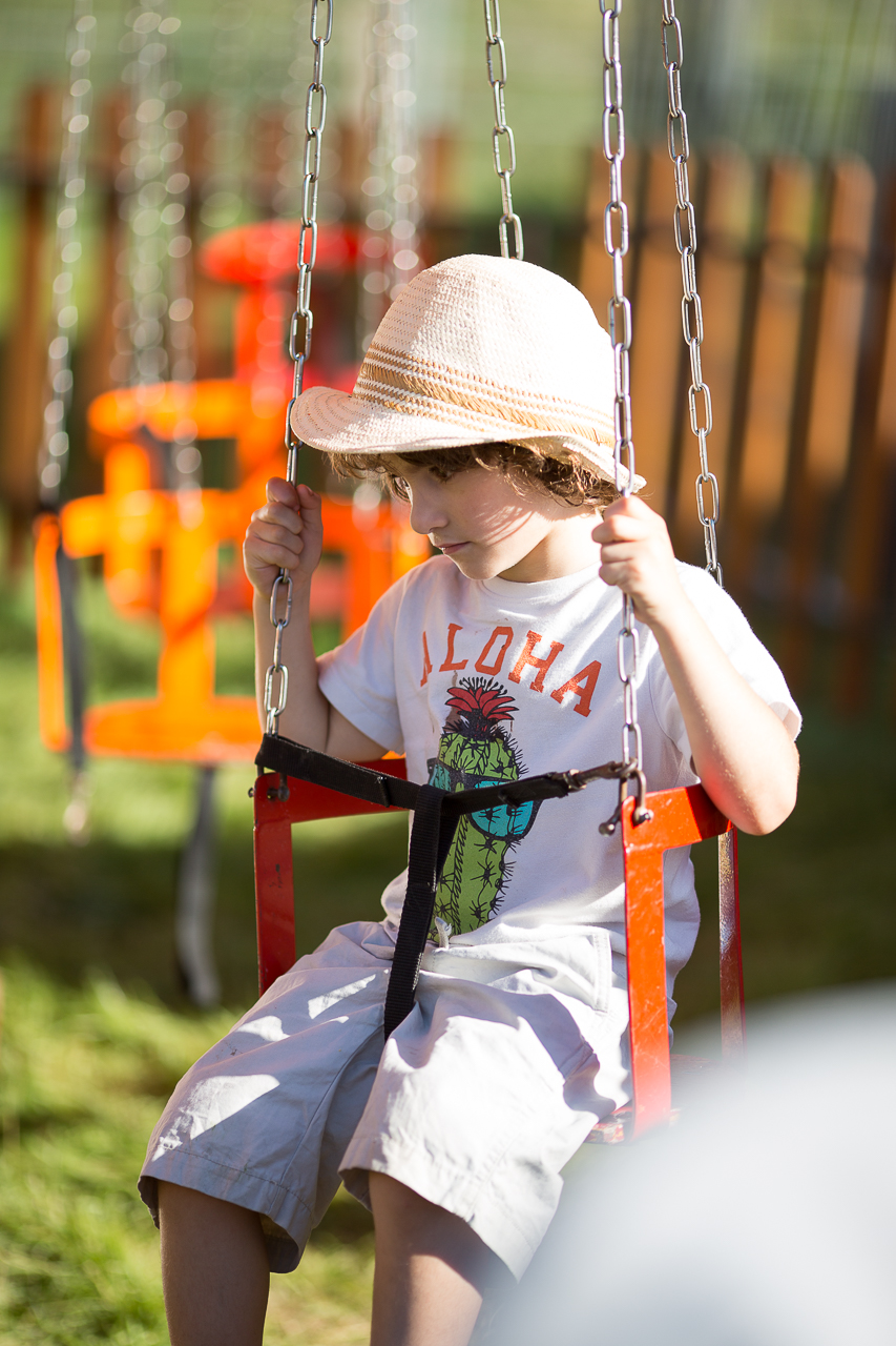 child enjoys the swings