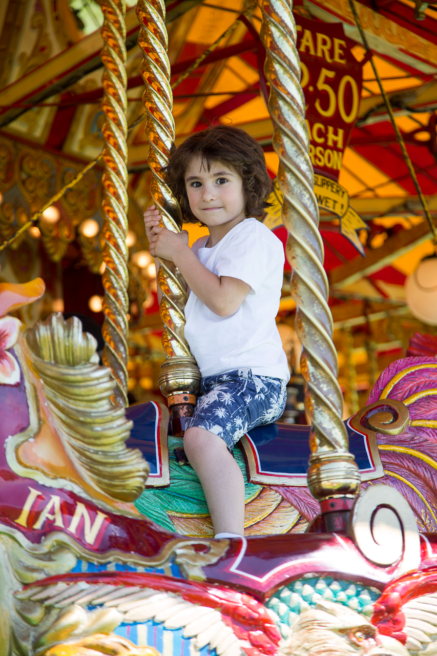 child on a carousel