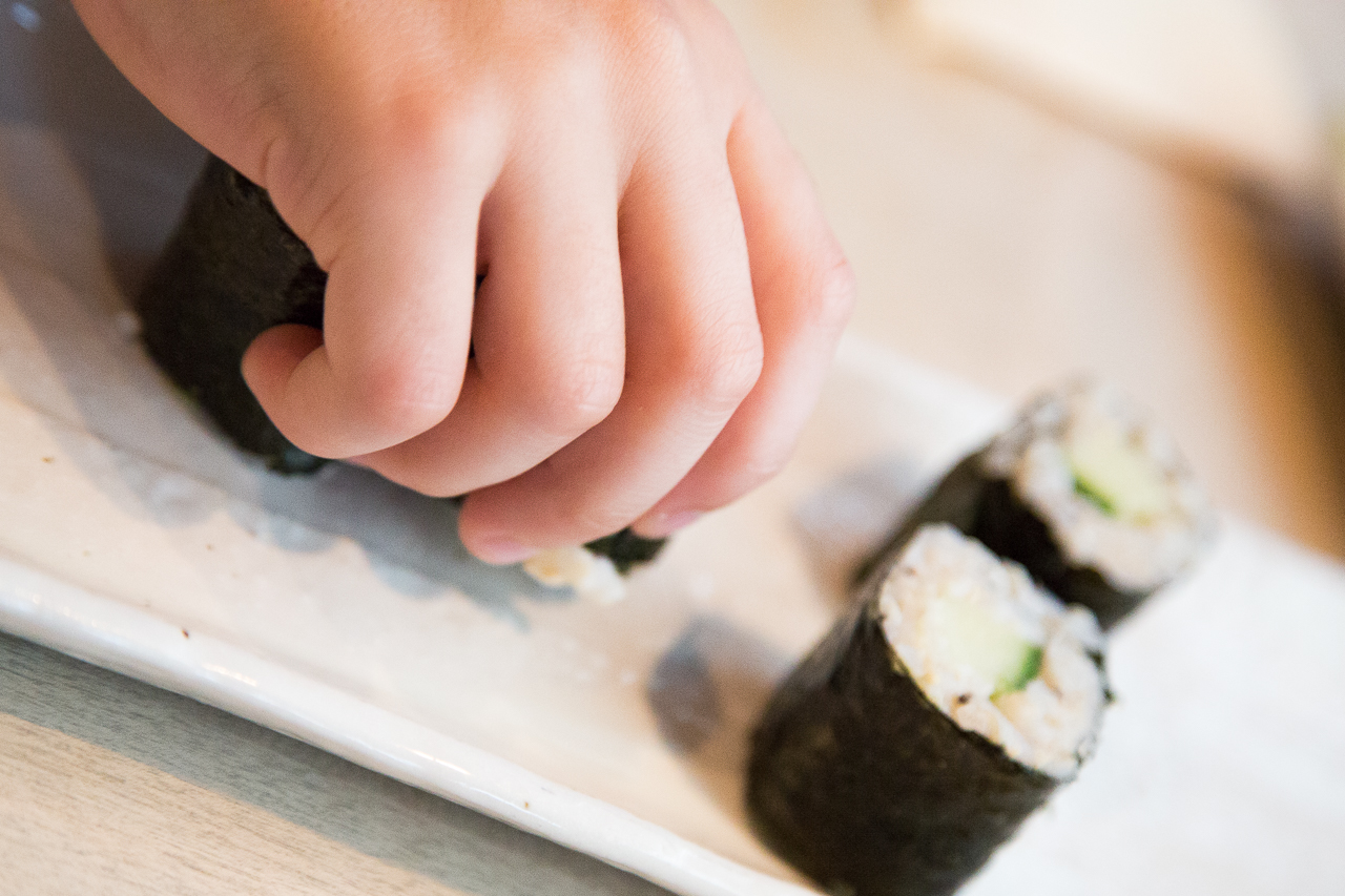 children eat sushi