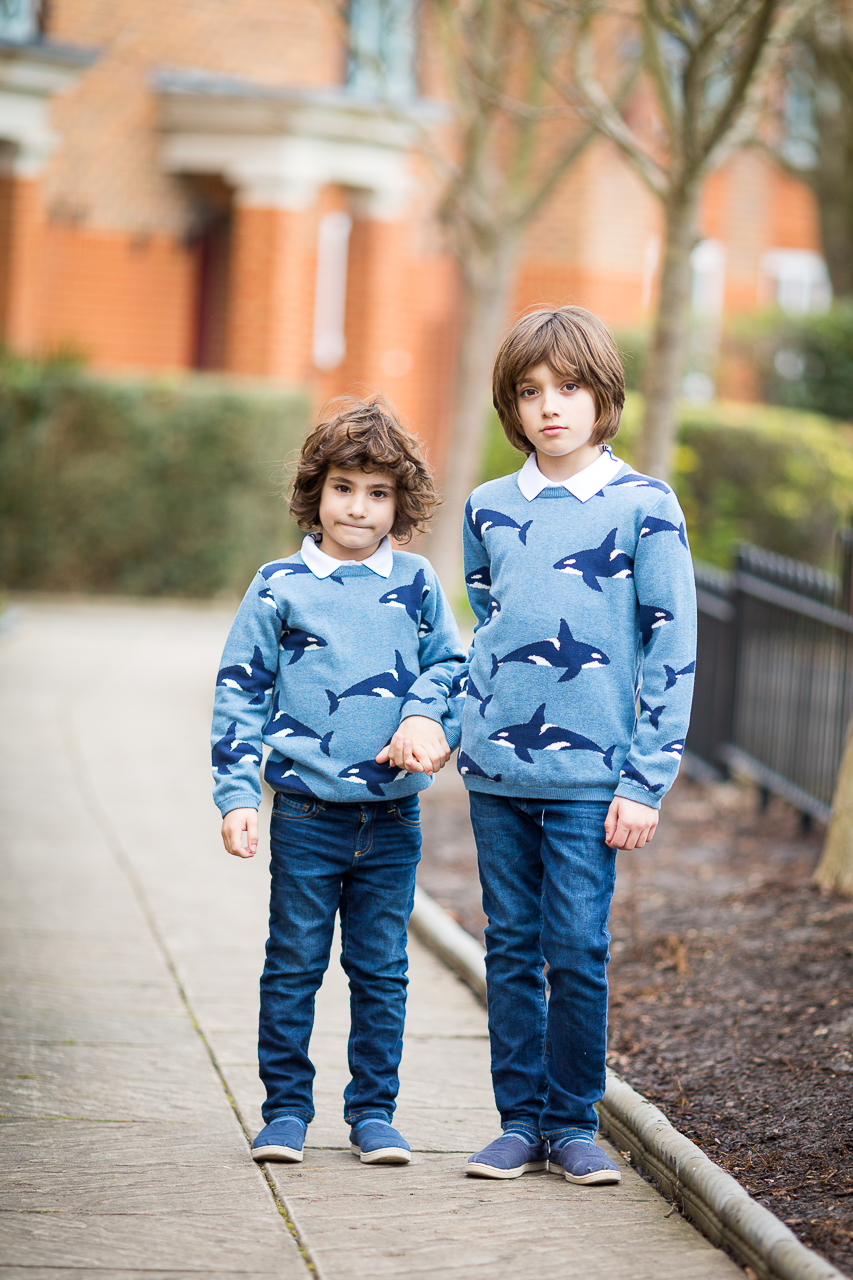boys in John Lewis whale print jumpers