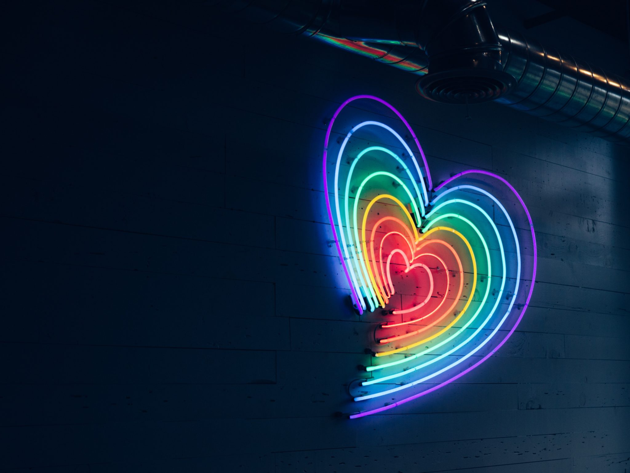 neon heart light representing a community