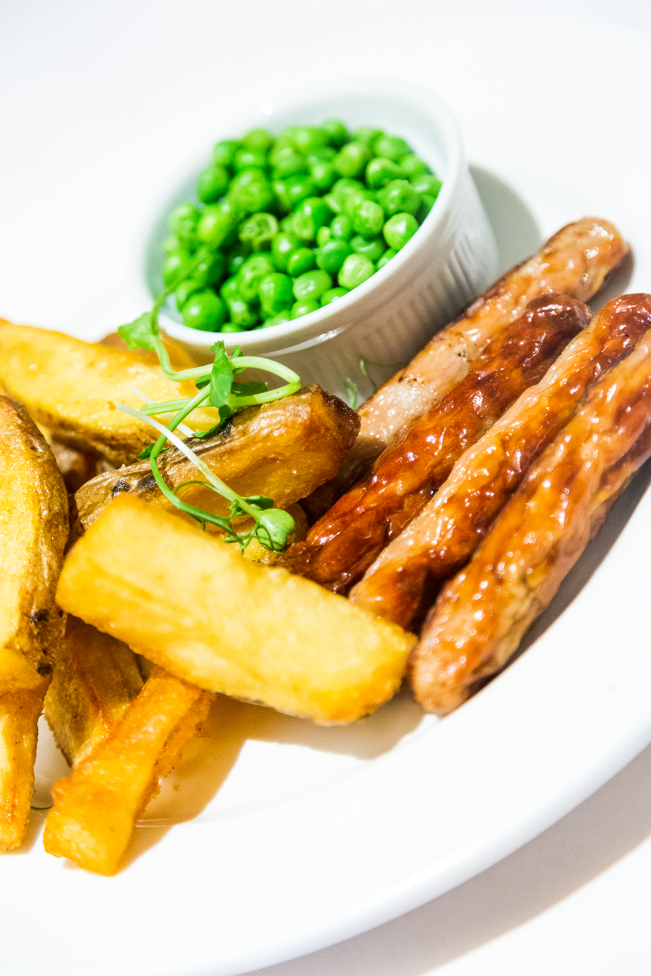 sausages, chips and peas